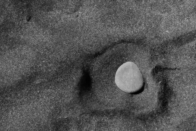 smooth stone on sand