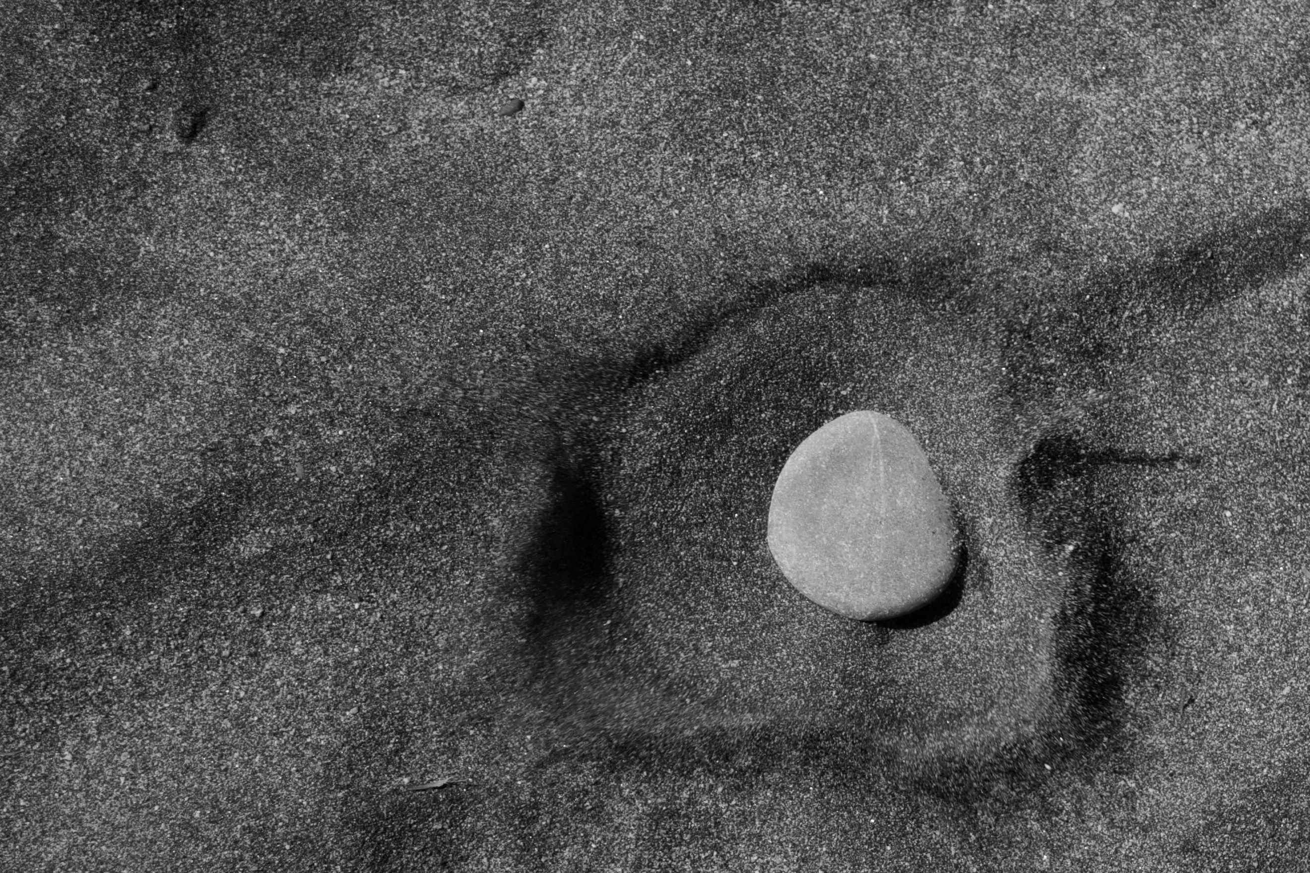 smooth stone on sand