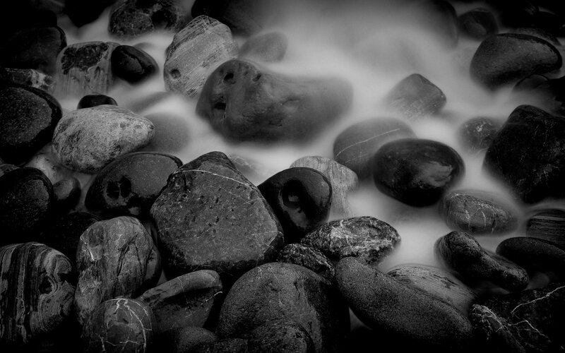 smooth stones in flowing water