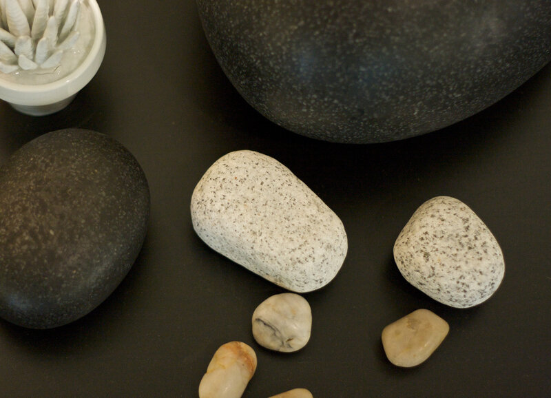 smooth stones on black surface
