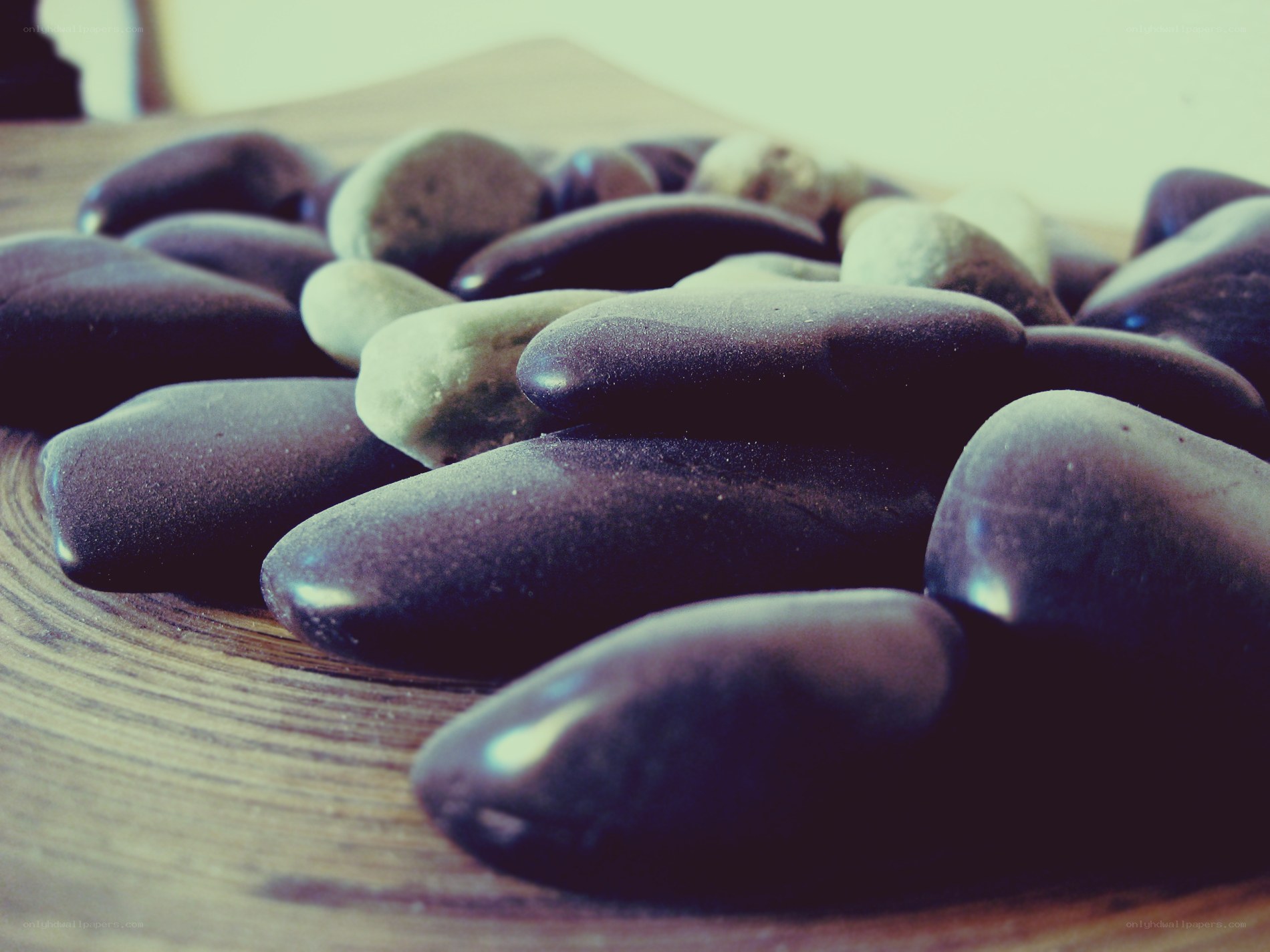 smooth stones on wood