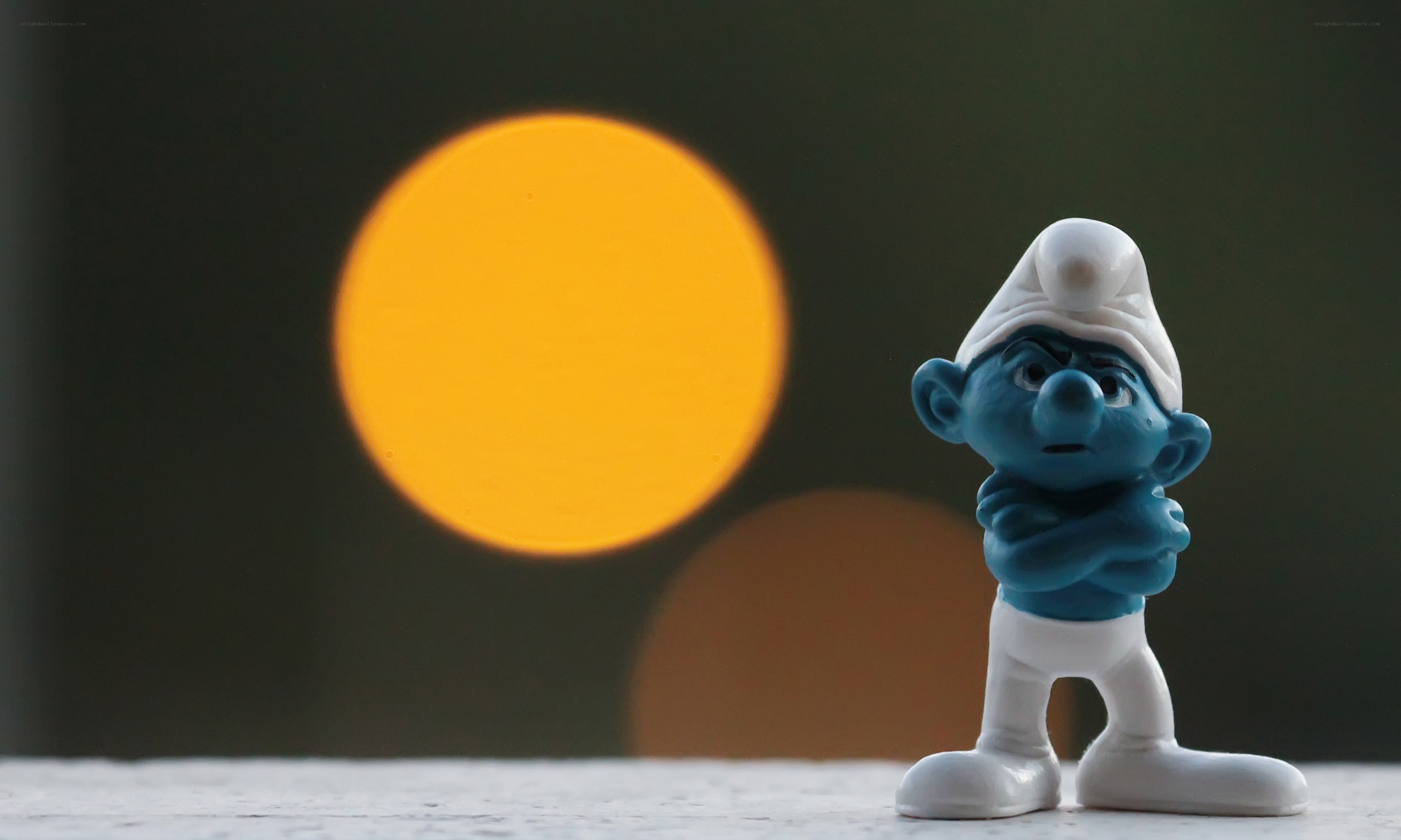 Smurf figurine with glowing orb