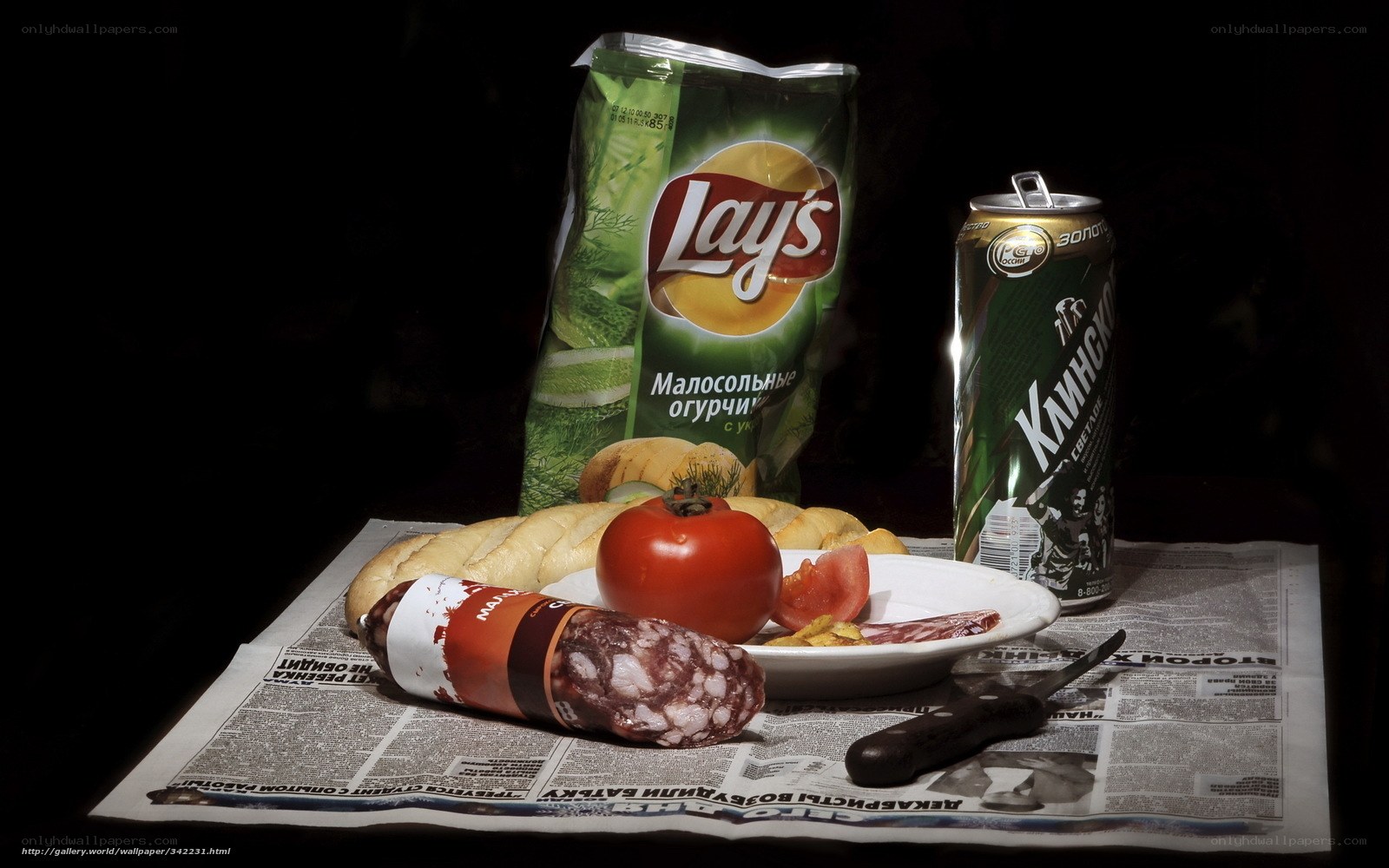 Snacks and beer on newspaper