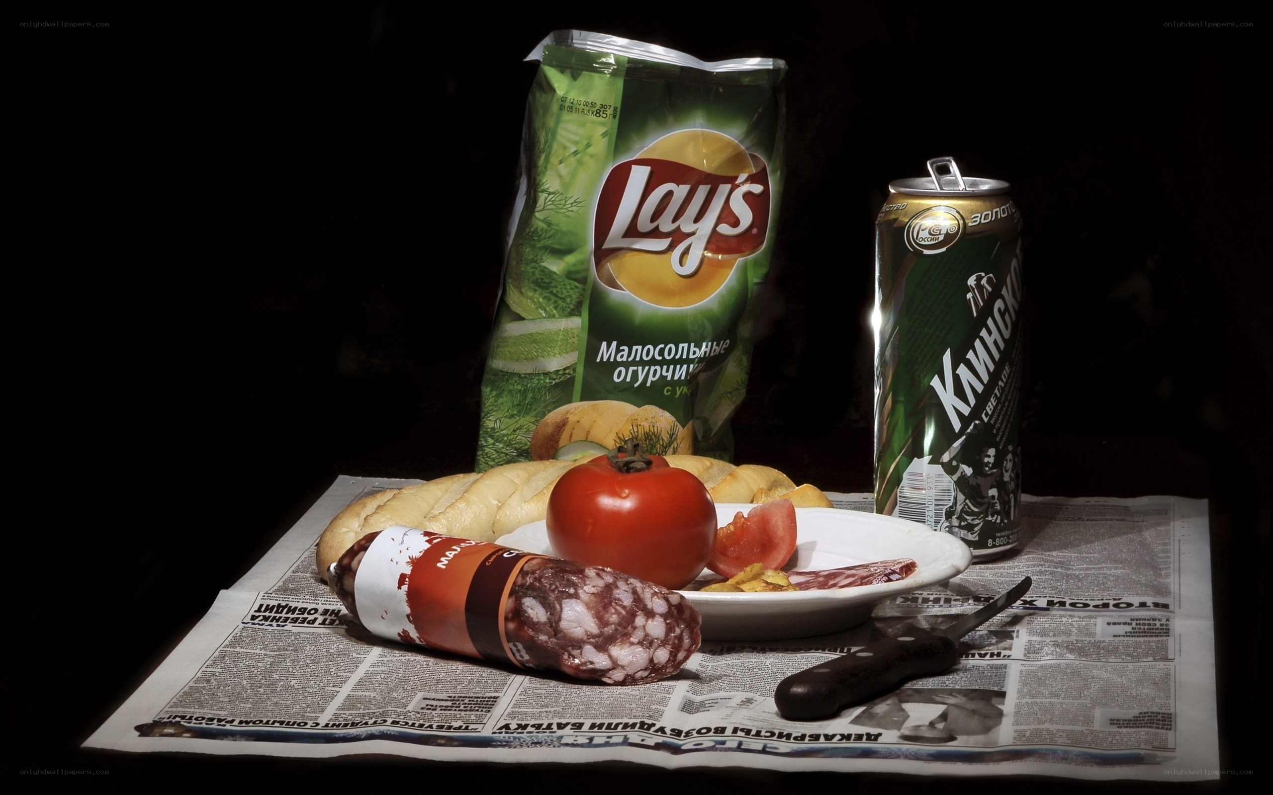 Snacks and drink on newspaper
