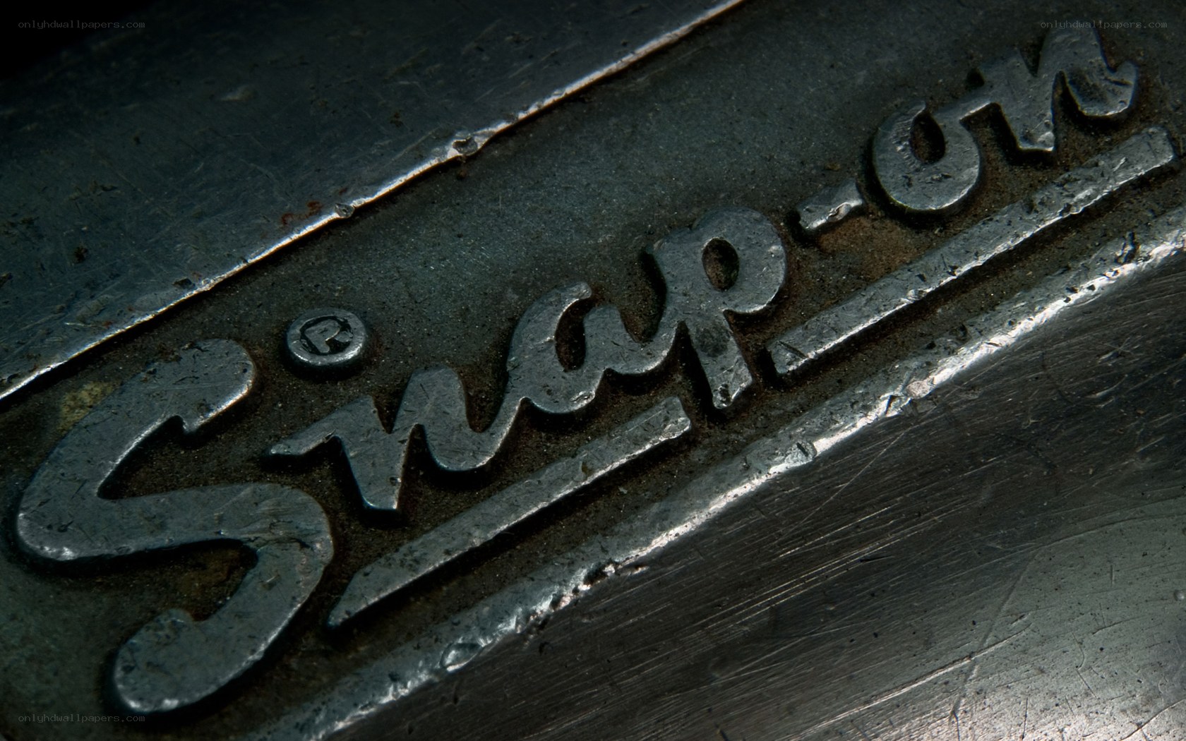 Snap-on logo on metal surface