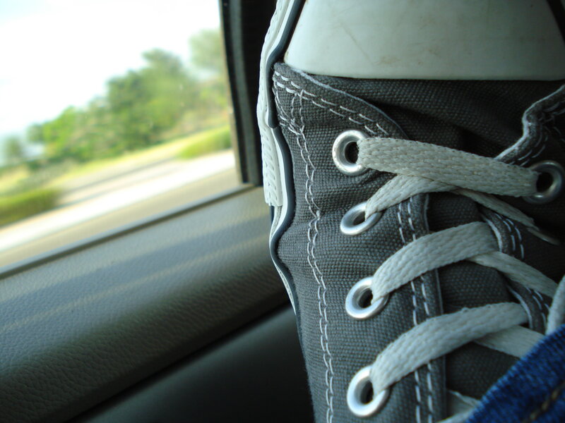 sneaker by car window