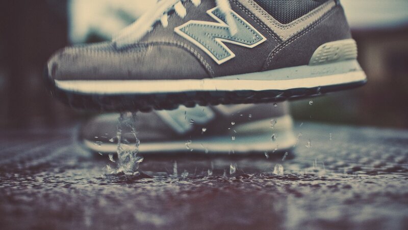 sneaker splashing in a puddle