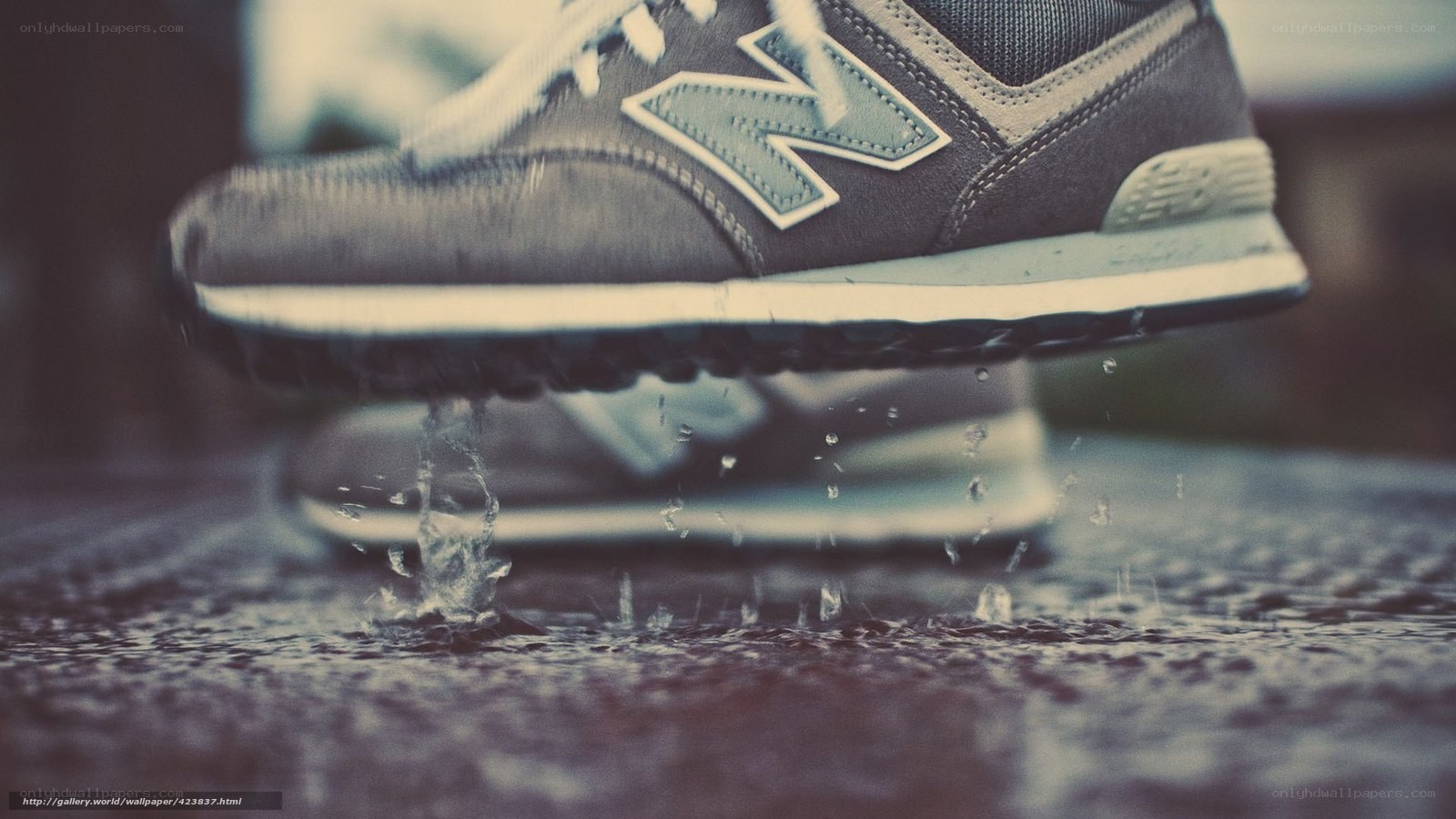 sneaker splashing in puddle