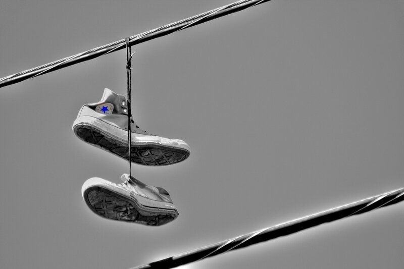 Sneakers hanging on a wire