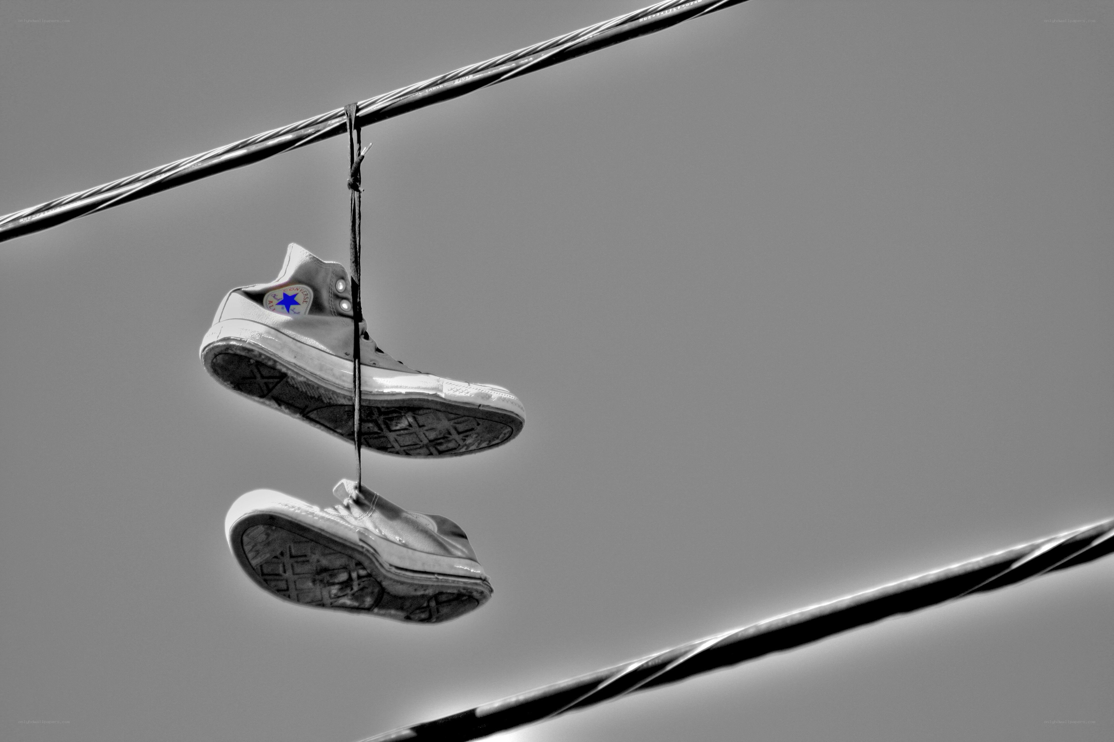 Sneakers hanging on a wire