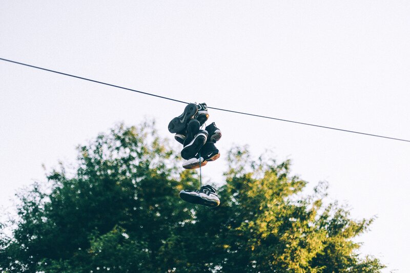 Sneakers Hanging on Wire — Green