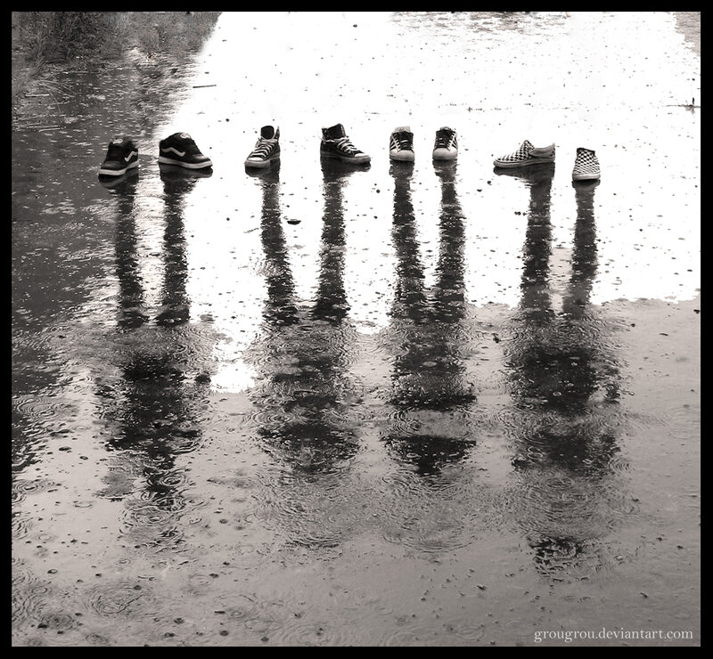 sneakers in a rain puddle