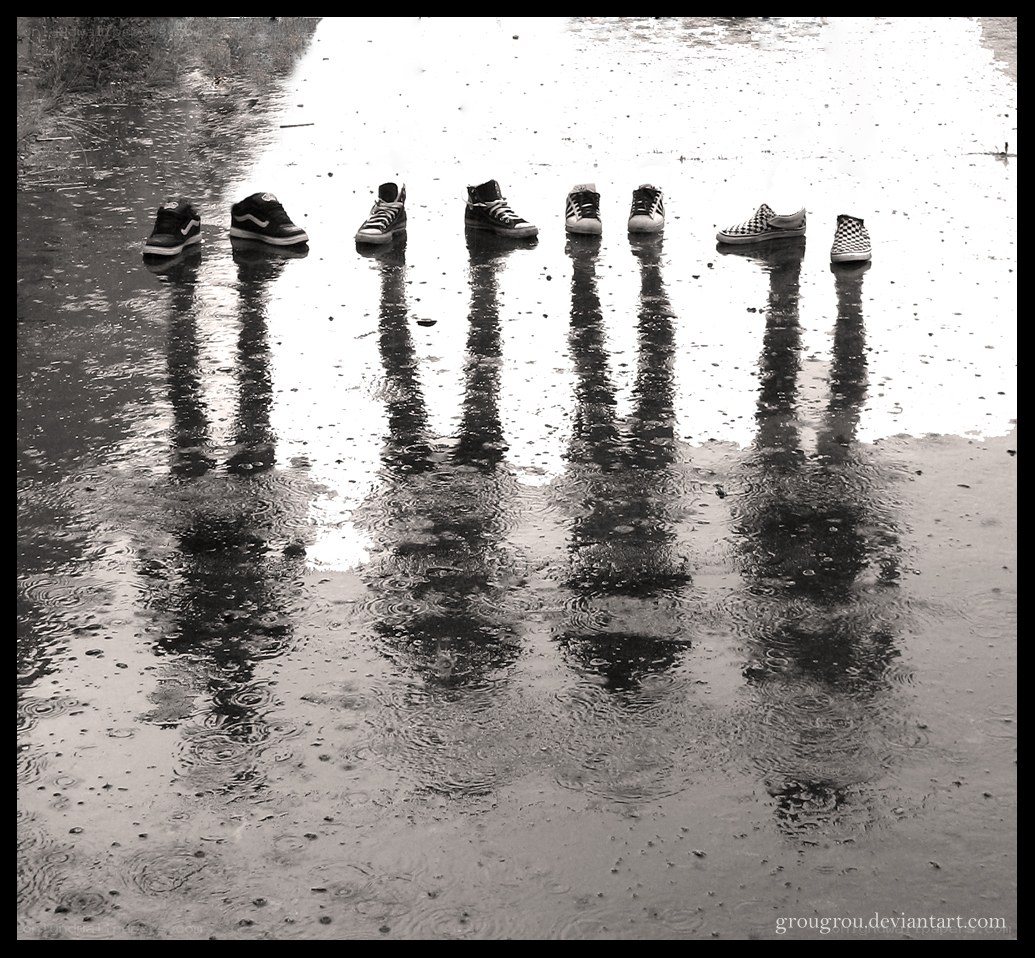 sneakers in a rain puddle