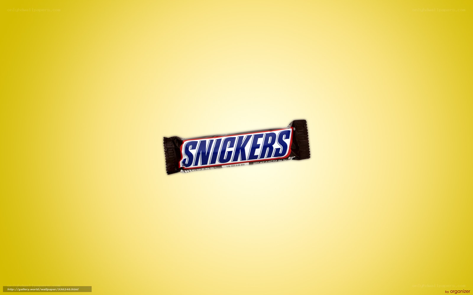 Snickers candy bar on yellow