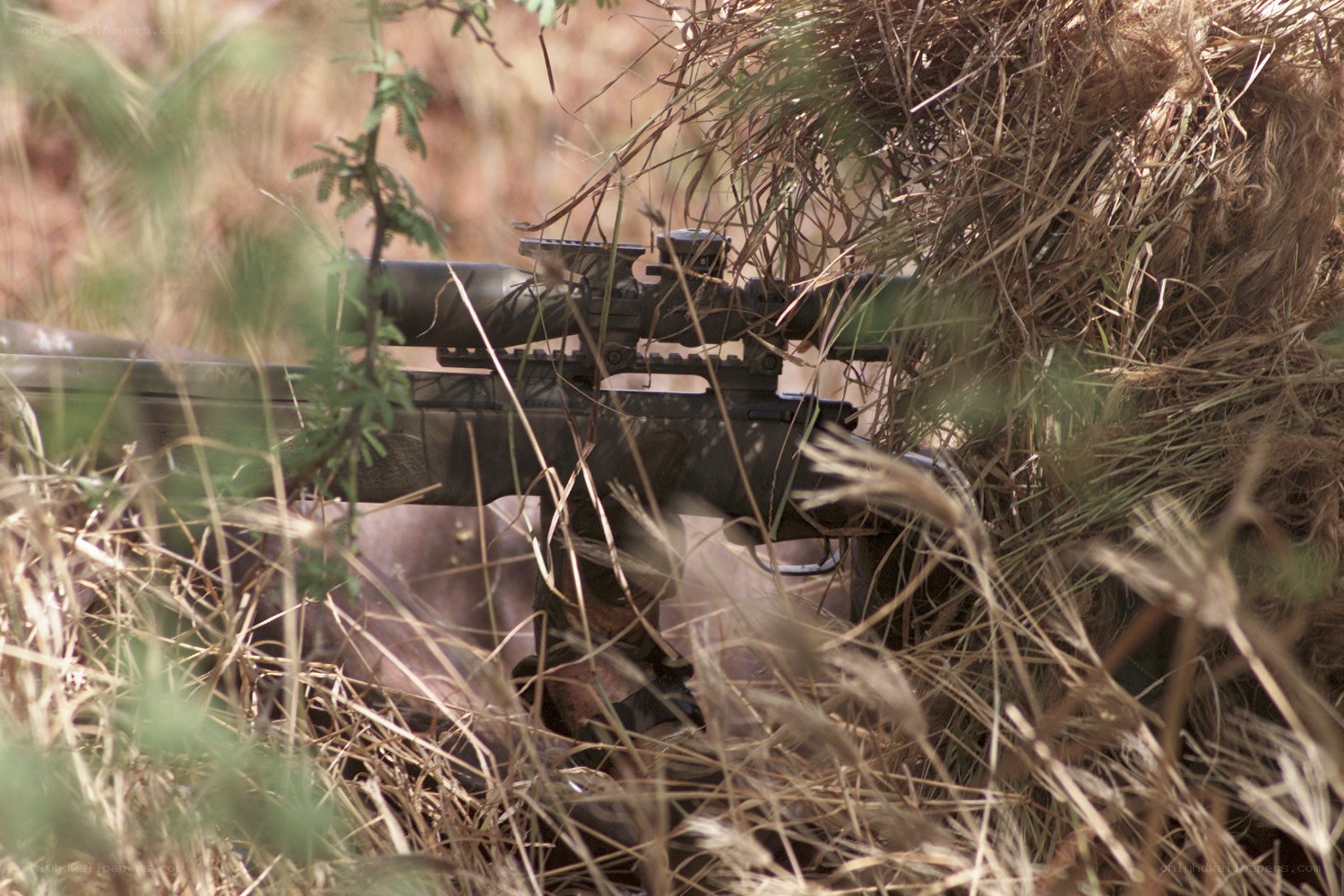 sniper in camouflage