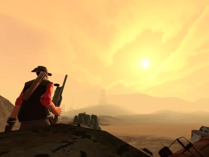 sniper in desert at sunset