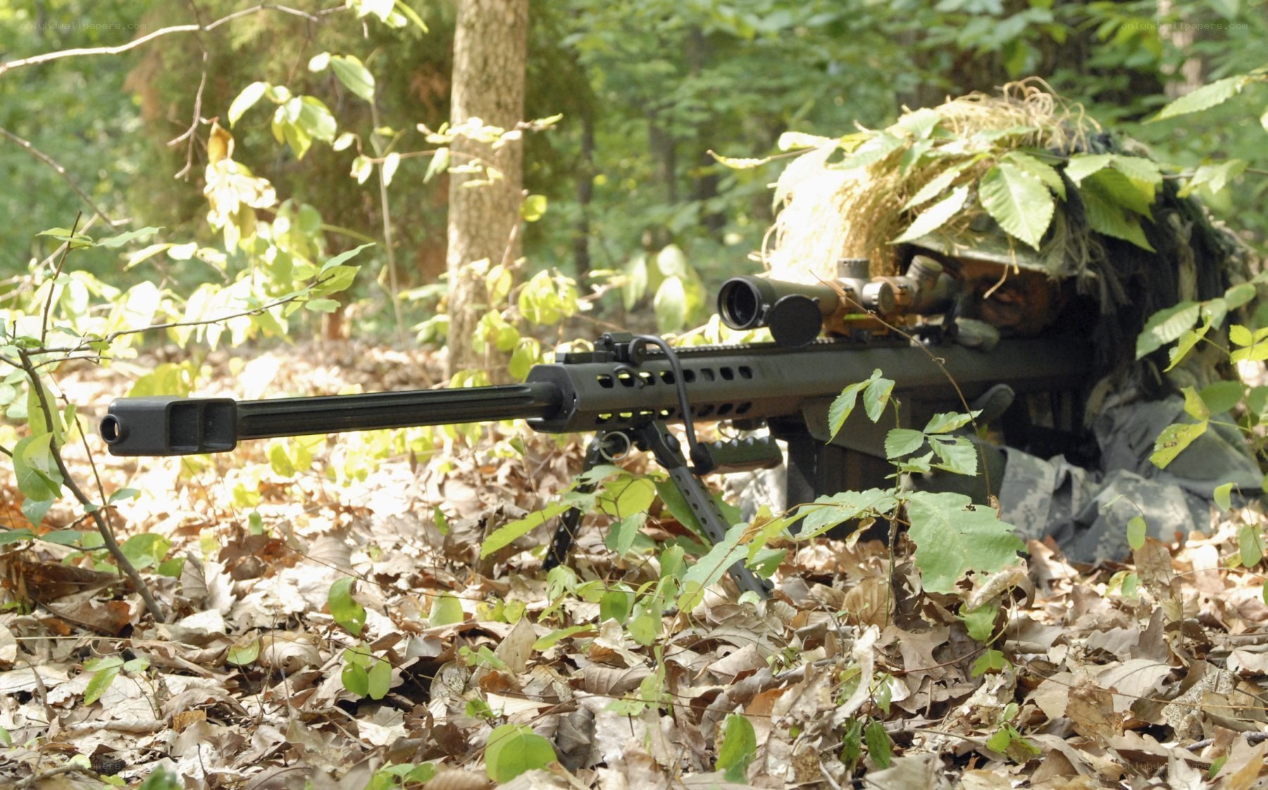 sniper in forest camouflage