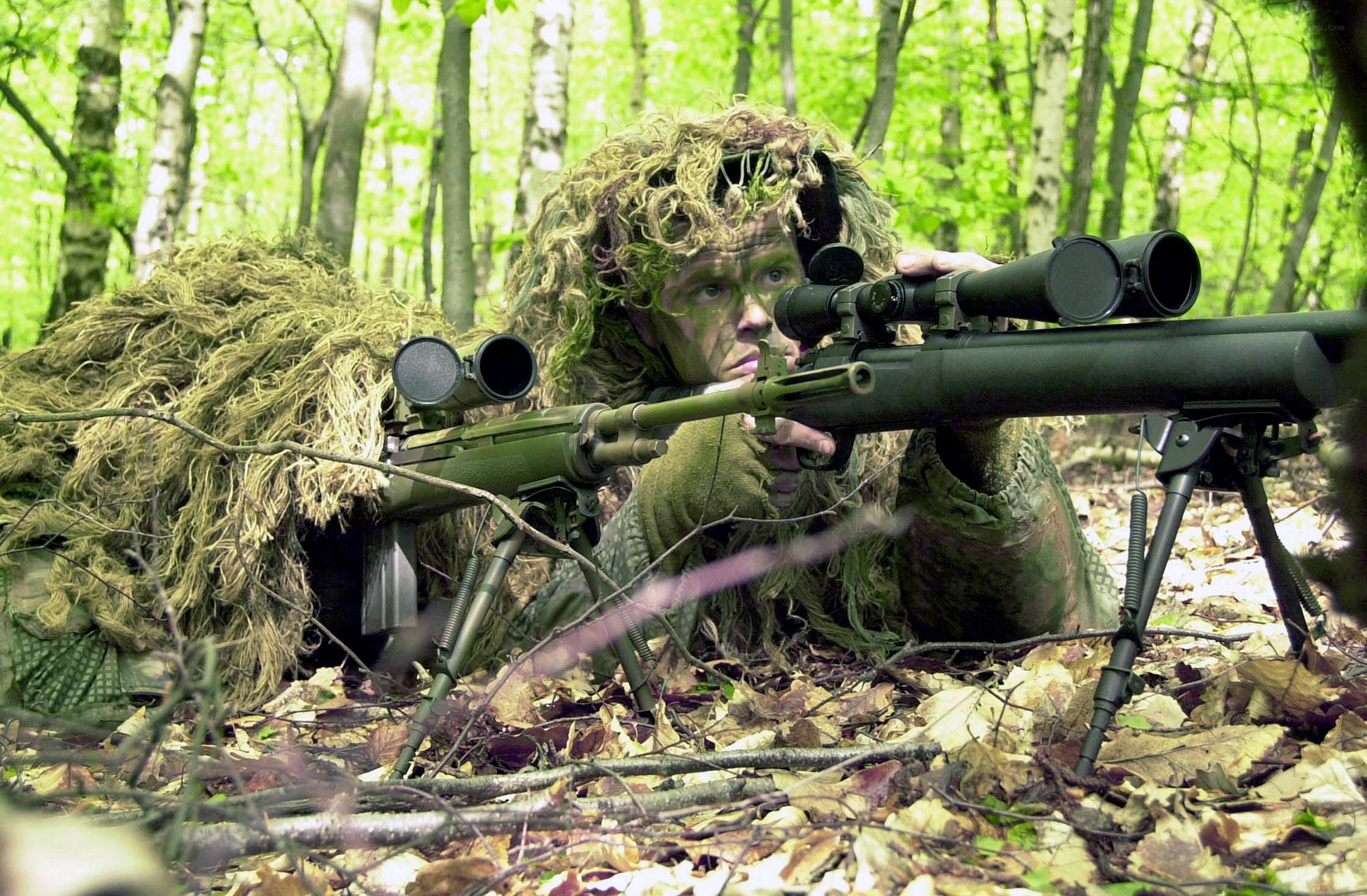 sniper in forest camouflage
