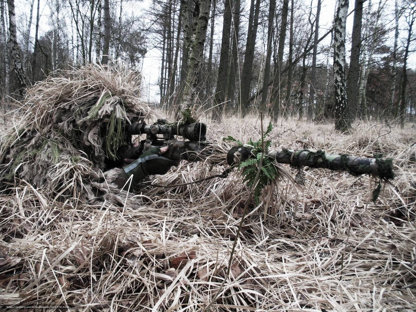 Sniper in forest camouflage