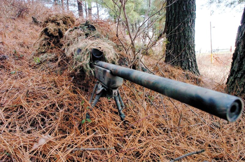 sniper in woodland camouflage