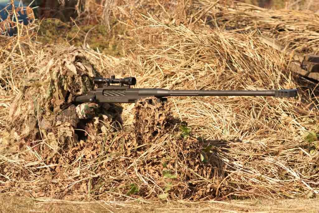 sniper rifle in camouflage
