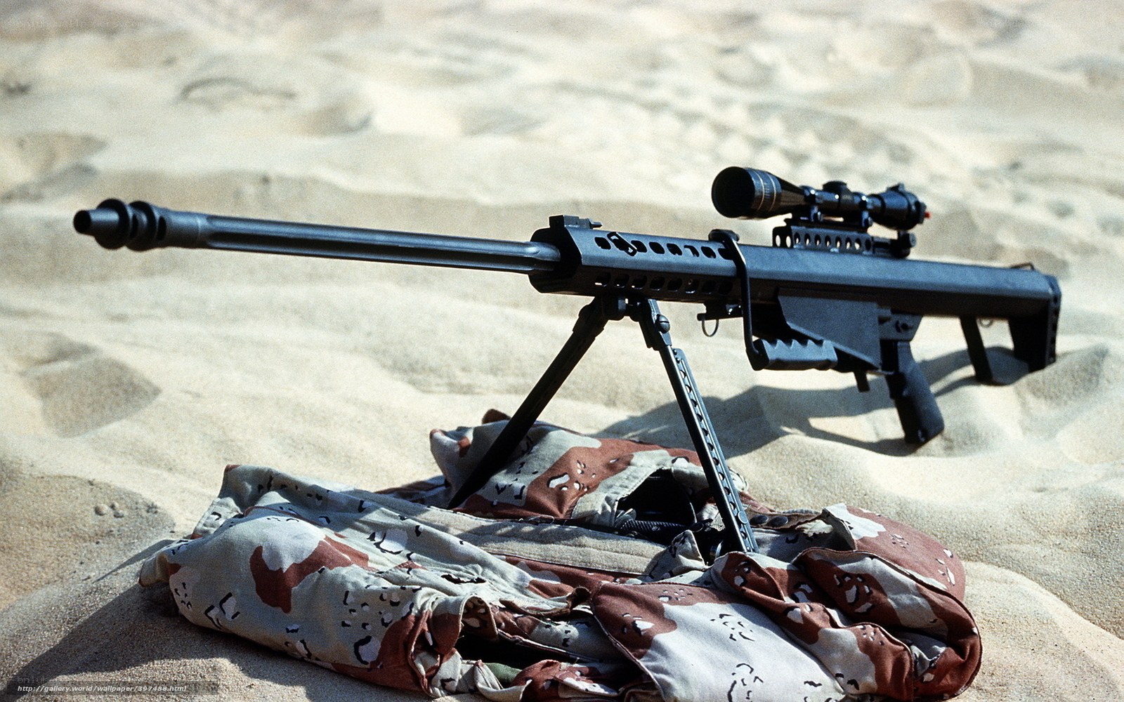 sniper rifle in desert sand