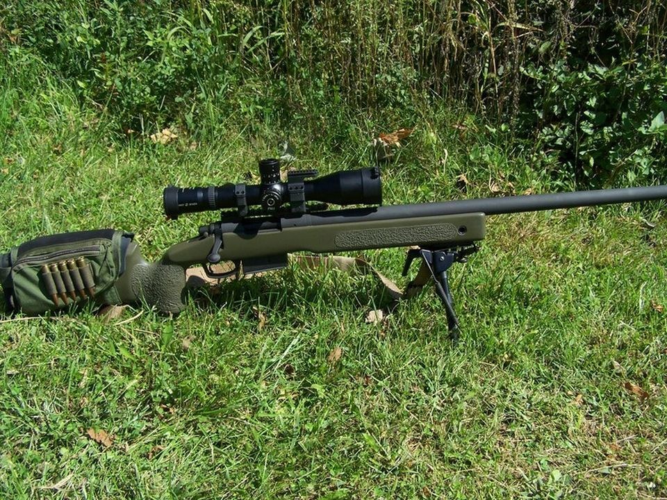 sniper rifle in grass