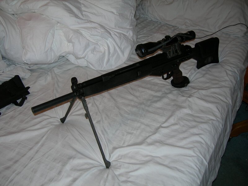 sniper rifle on bed