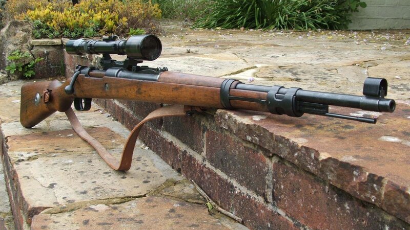 Sniper Rifle on Brick Wall — Brown