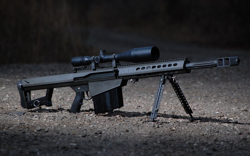 sniper rifle on gravel