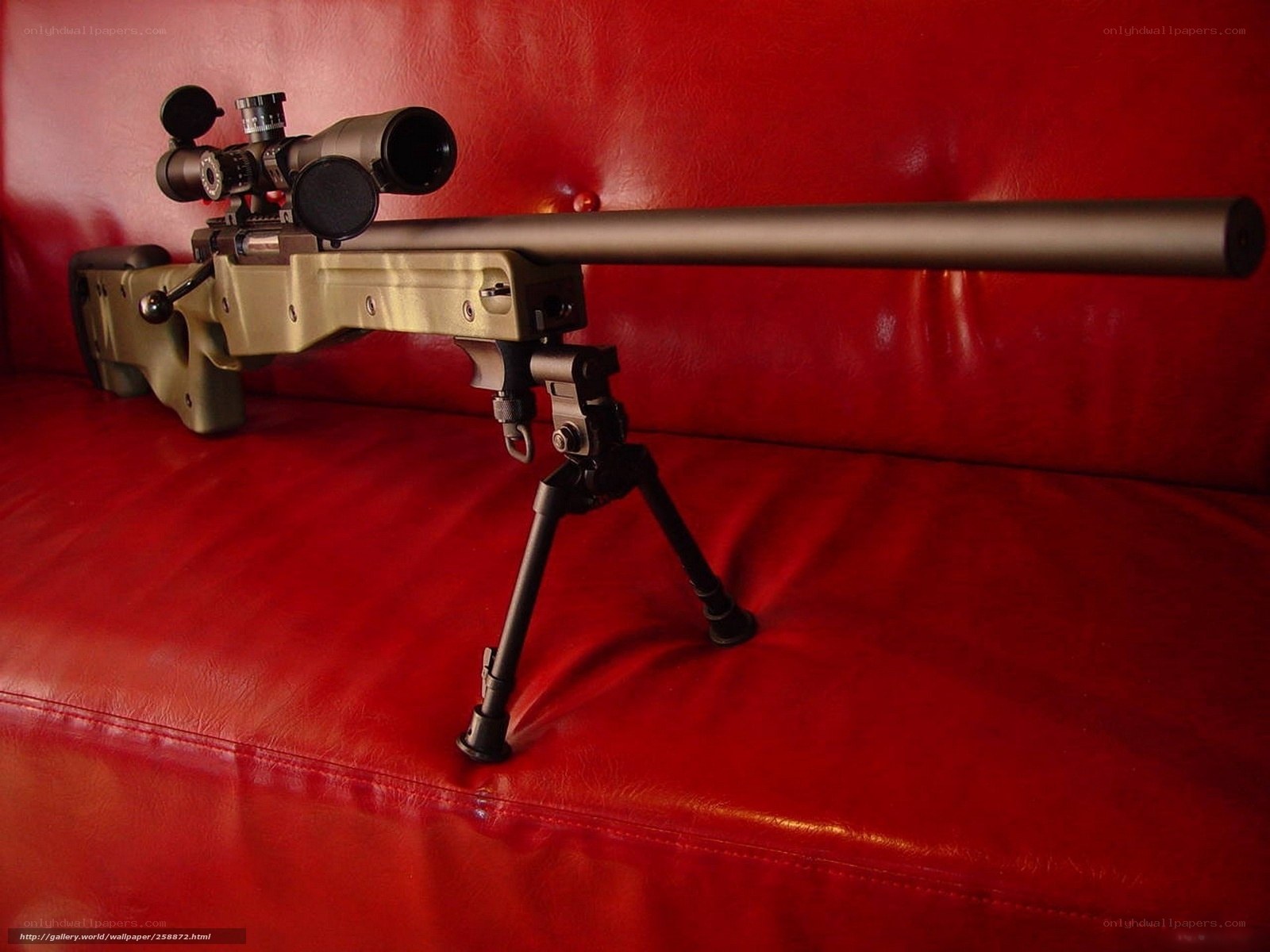 sniper rifle on red couch
