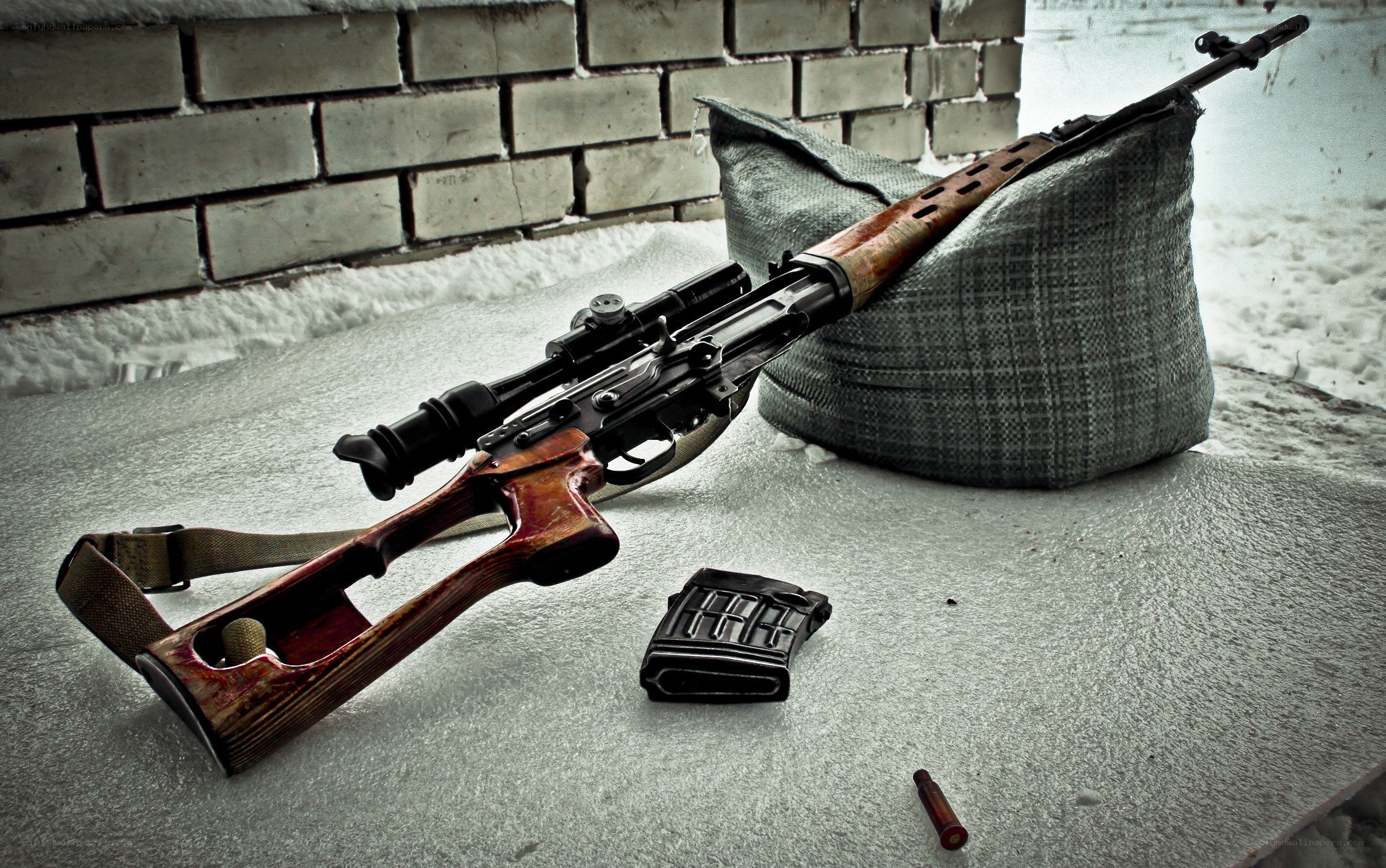sniper rifle on sandbag