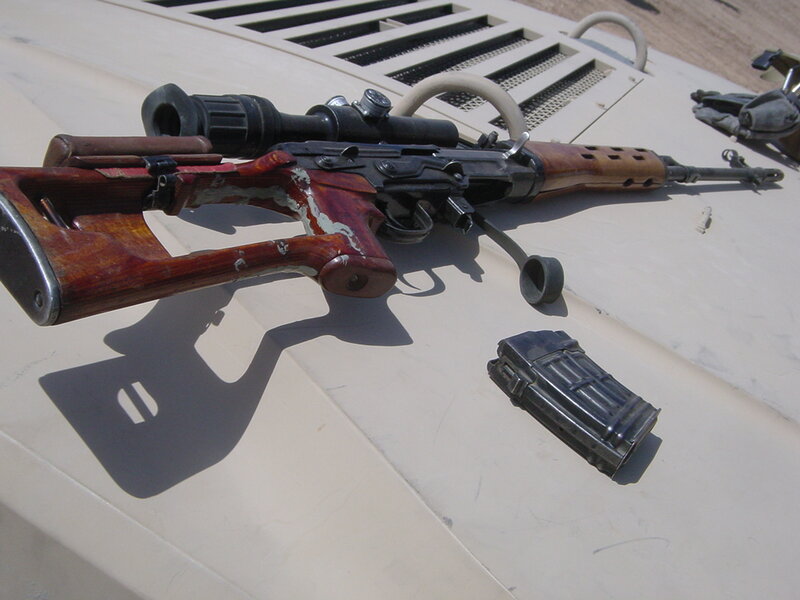 sniper rifle on vehicle roof