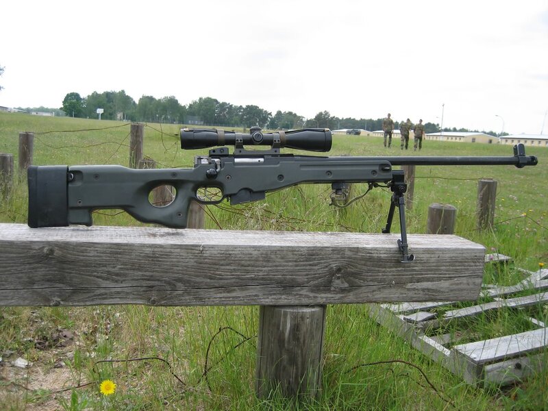 sniper rifle on wooden bench