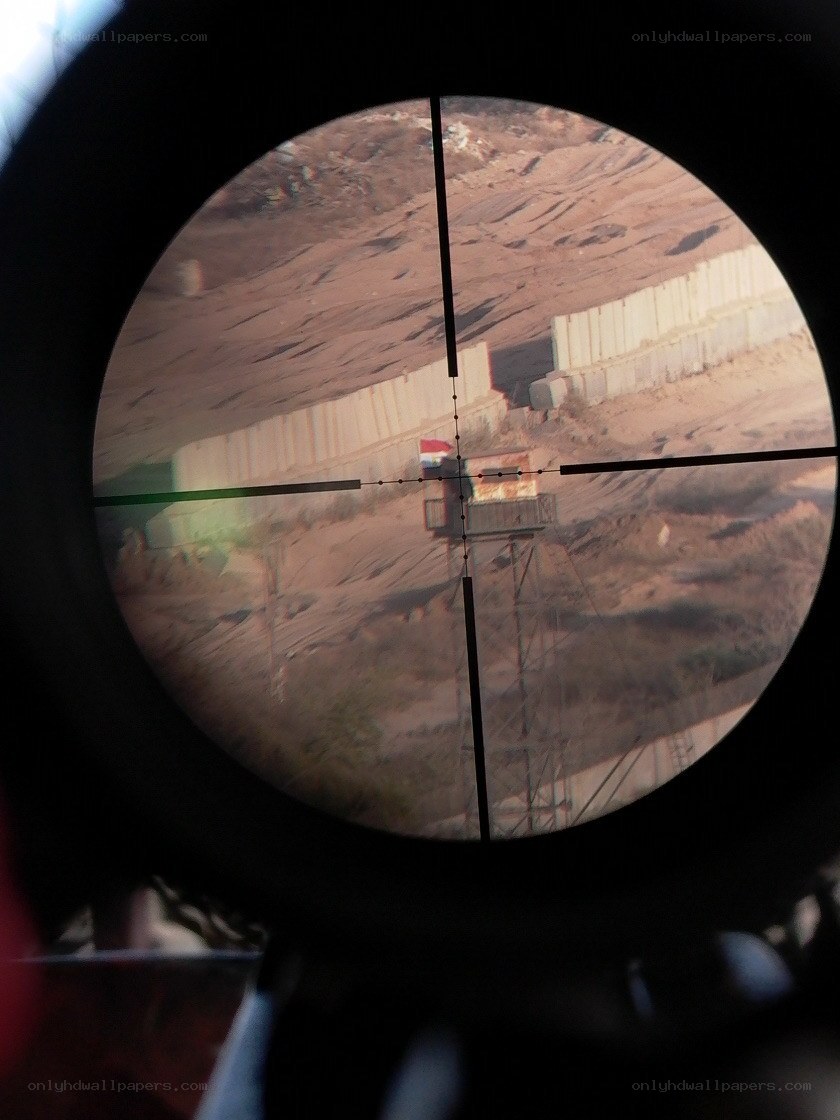 Sniper scope view of border post