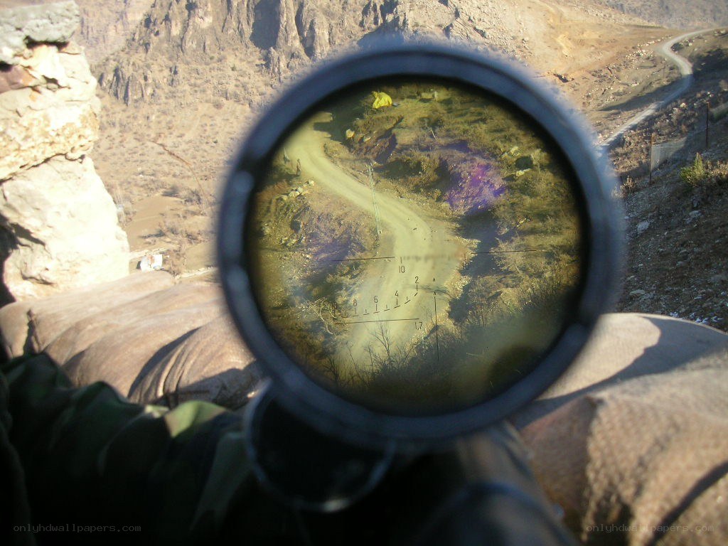sniper scope view of mountain road