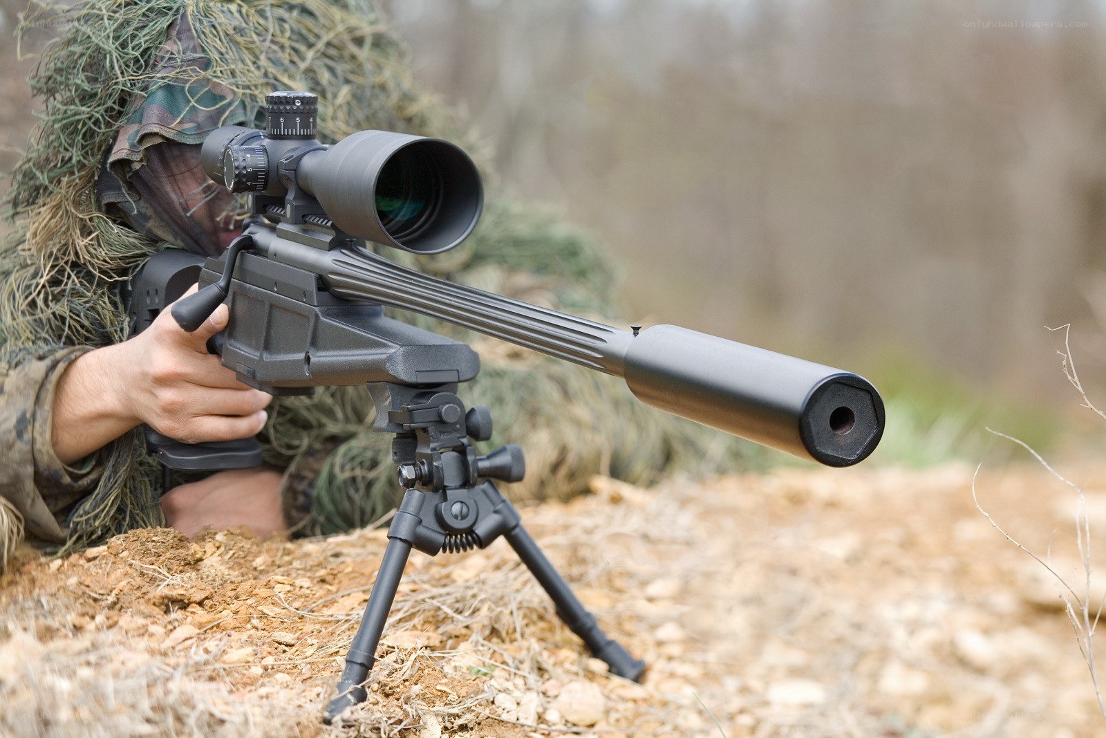 sniper with scoped rifle