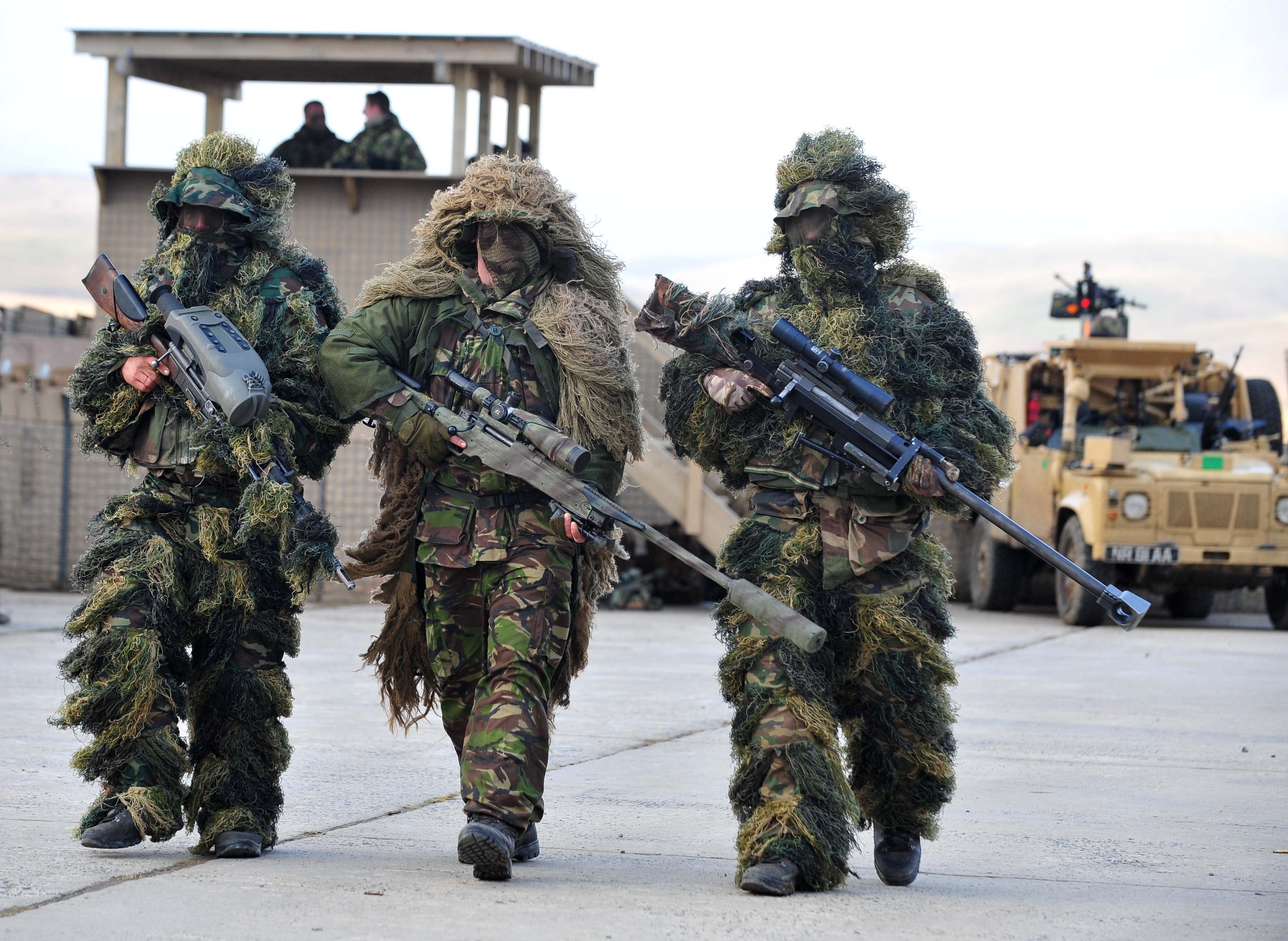 Snipers in ghillie suits