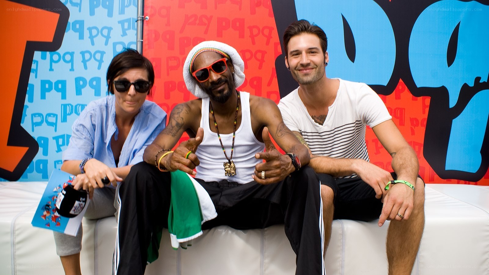 Snoop Dogg with two people