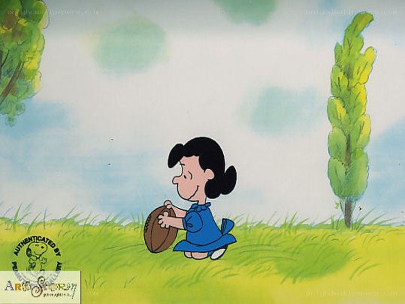 Snoopy holding a football