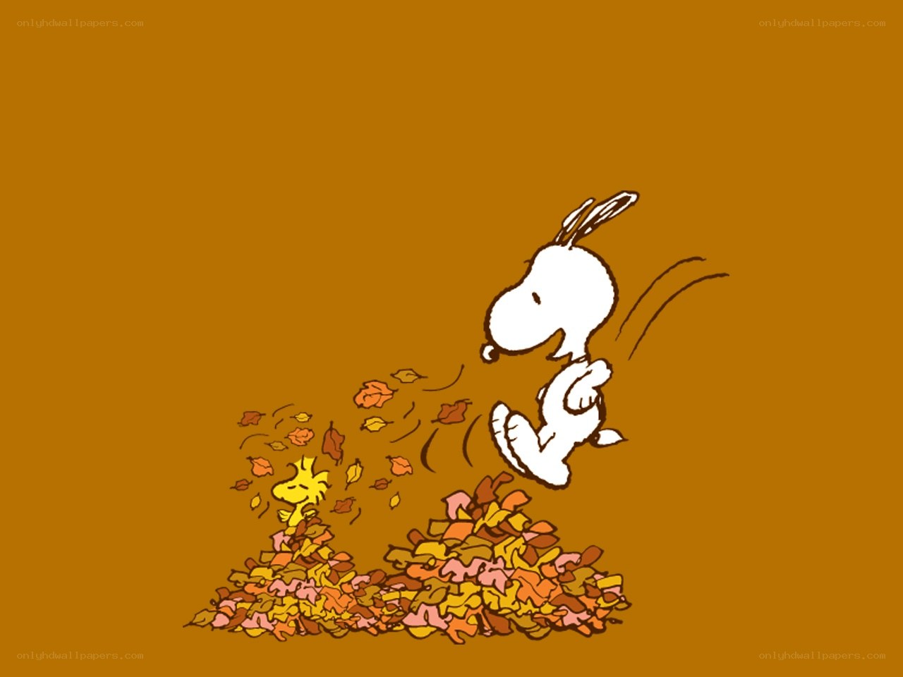 Snoopy jumping in leaves