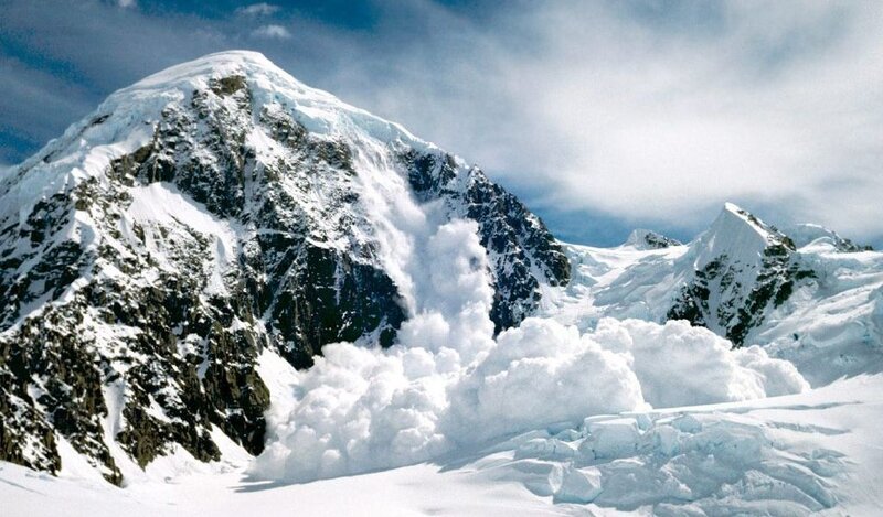 Snow avalanche on mountain peak