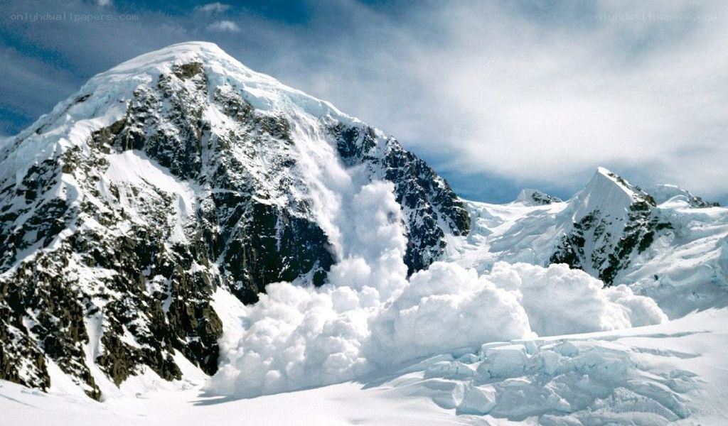Snow avalanche on mountain peak