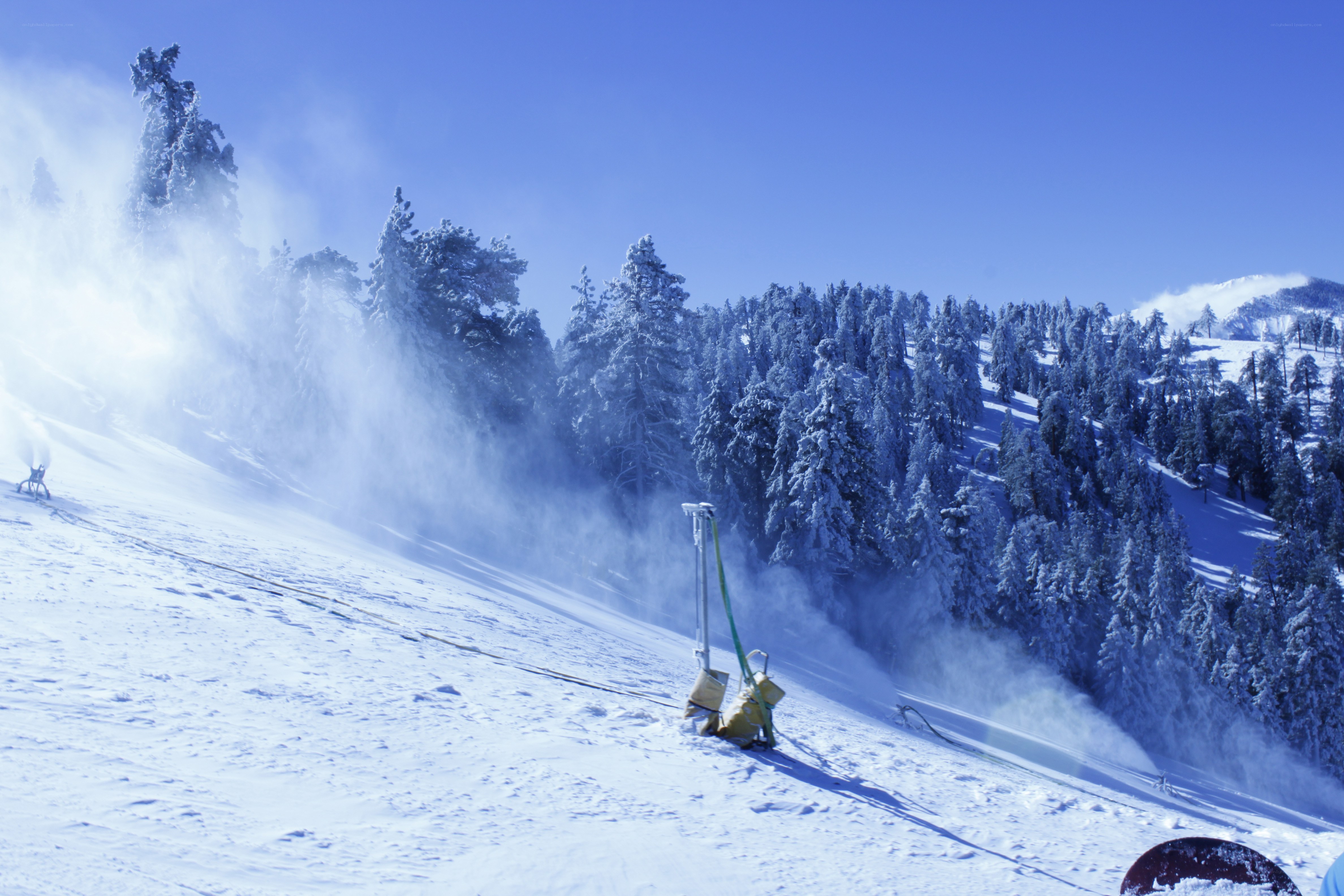 Snow cannon on a ski slope