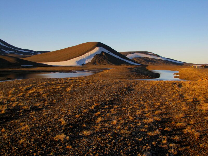 Snow-capped hills at sunset