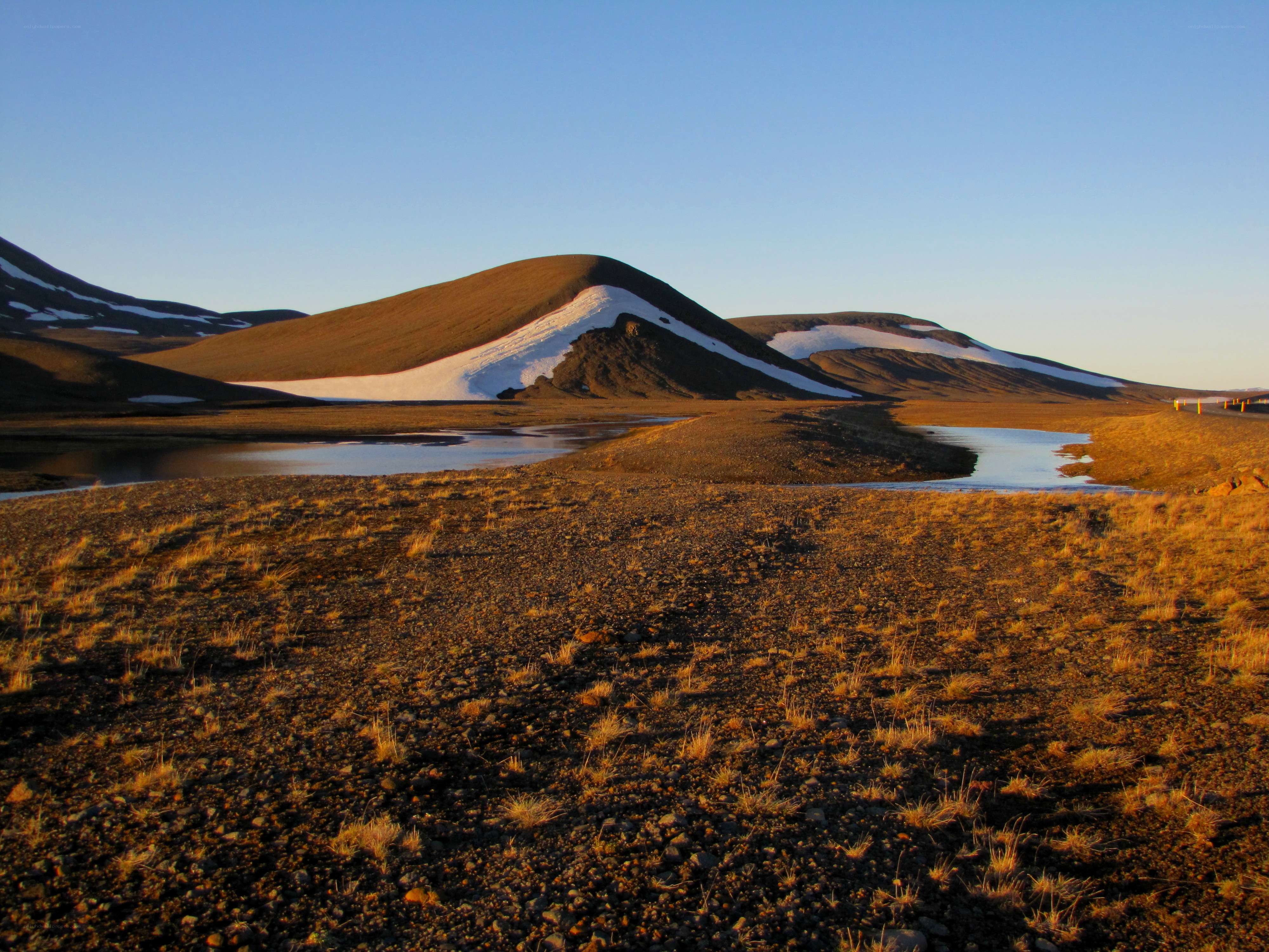 Snow-capped hills at sunset