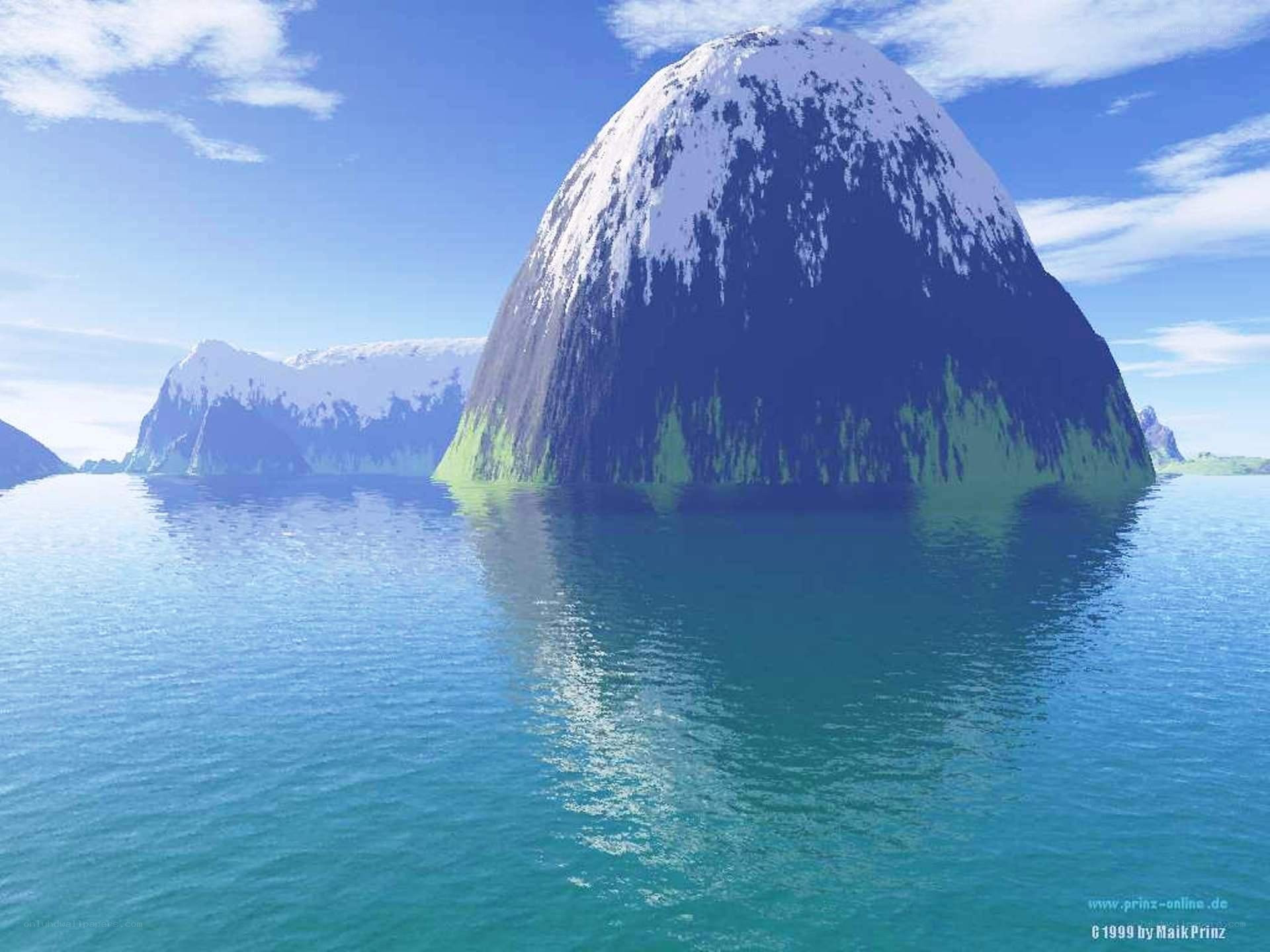 Snow-capped island in blue sea