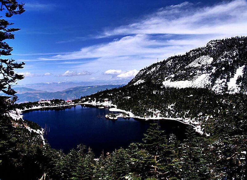 Snow-capped Lake in Mountains