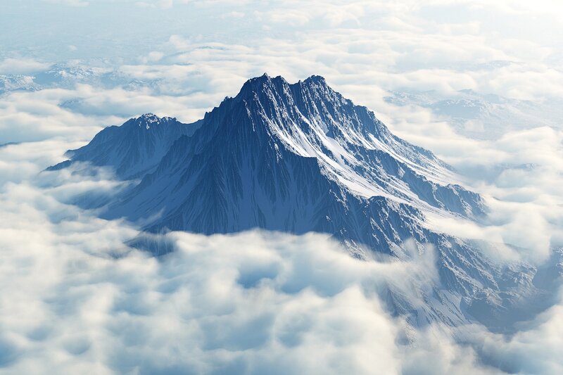 Snow-capped mountain above clouds