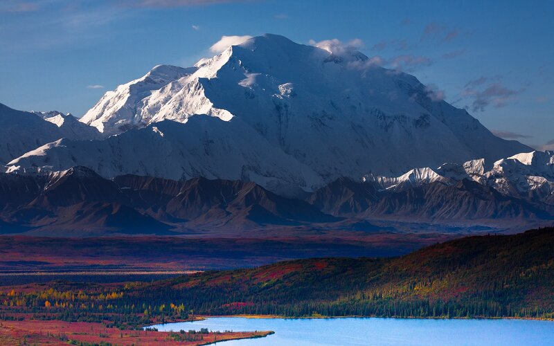 Snow-capped mountain and autumn lake